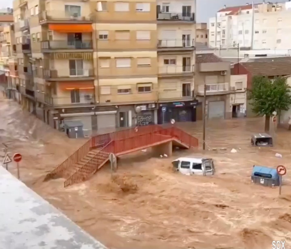 The streets of Murcia as cars became stranded after the heavy storms