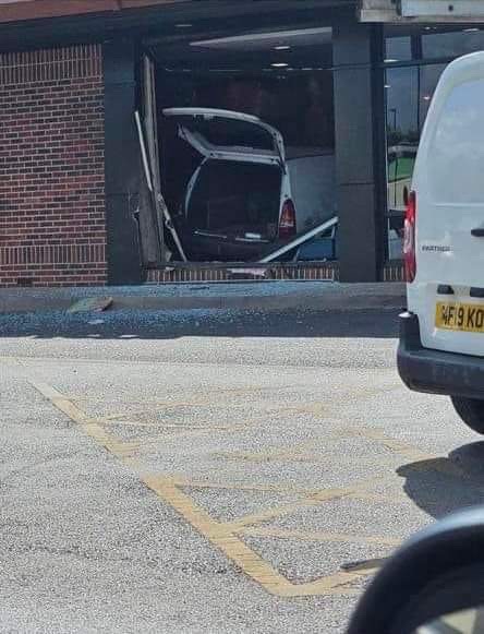 The Vauxhall Astra ploughed into the fast food restaurant on Saturday