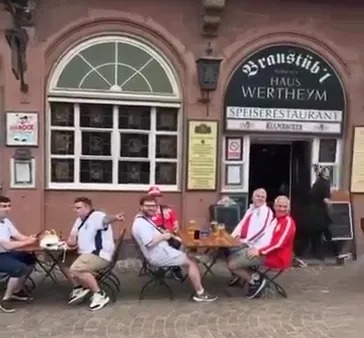 Watch moment the Sky Sports legend was serenaded by England fans as he walks through Frankfurt