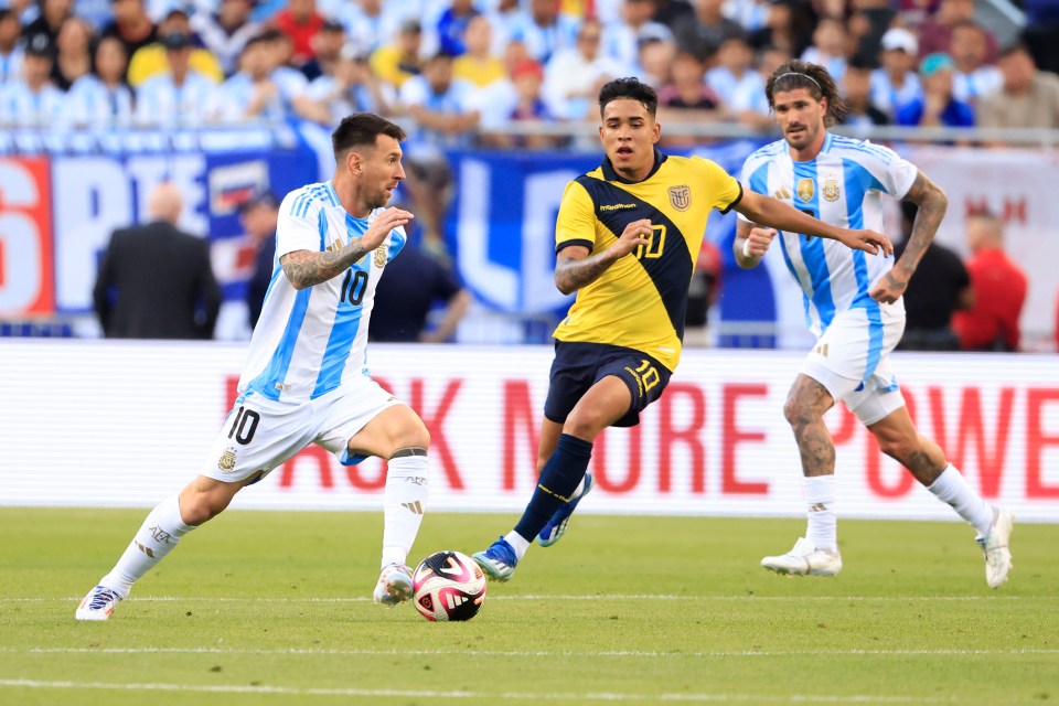 Lionel Messi pictured in action against Ecuador's Kendry Paez last night