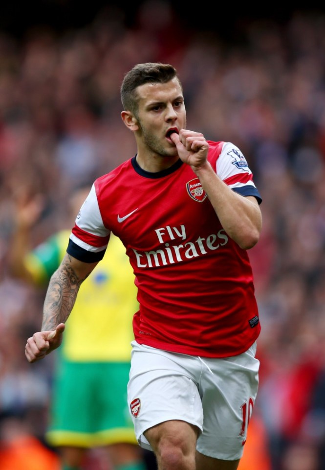 LONDON, ENGLAND - OCTOBER 19:  Jack Wilshere of Arsenal celebrates as he scores their first goal during the Barclays Premier League match between Arsenal and Norwich City at Emirates Stadium on October 19, 2013 in London, England.  (Photo by Paul Gilham/Getty Images)