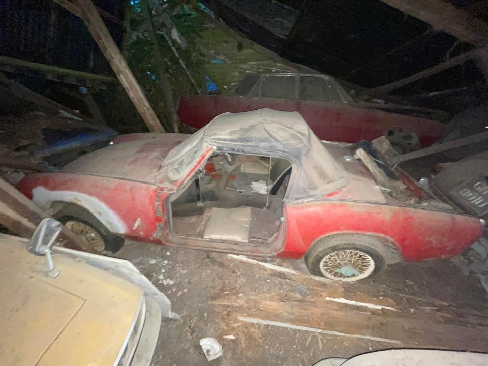 The classic Triumph was found alongside other cars and covered in dust