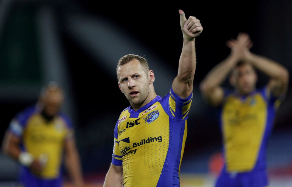 Rob Burrow acknowledges the fans after the match