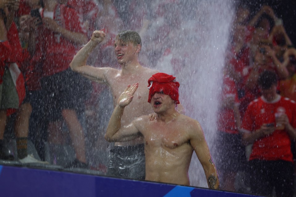 Fans braved the conditions and danced in the downpour