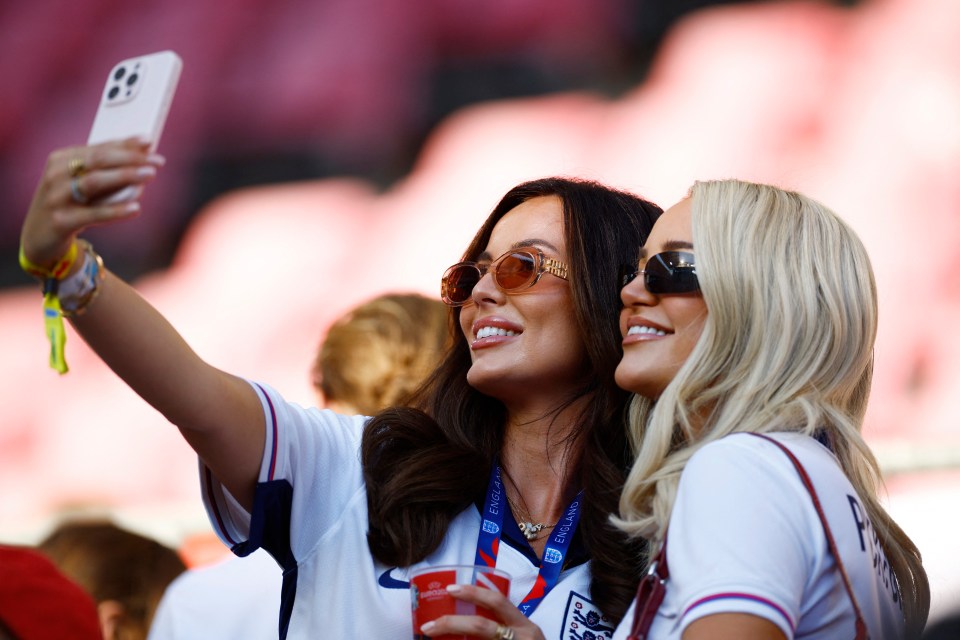 Ellie, pictured her with Jordan Pickford's wife Megan, has watched on from the stands all tournament leading up to her partner's Holland heroics