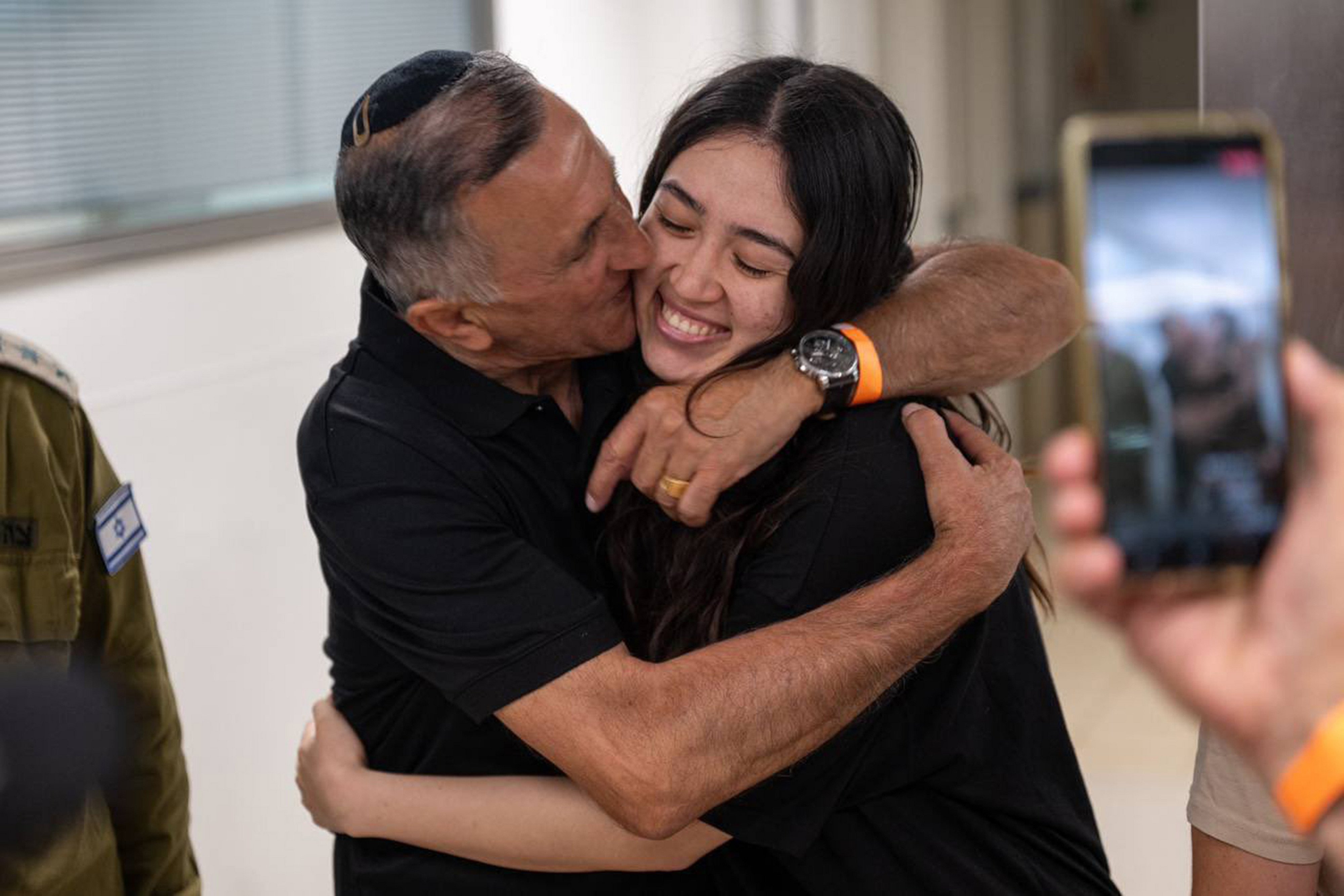 Noa embraces her father Yaakov during a tearful reunion after being rescued