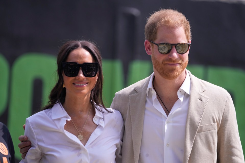 a man and a woman wearing sunglasses stand next to each other