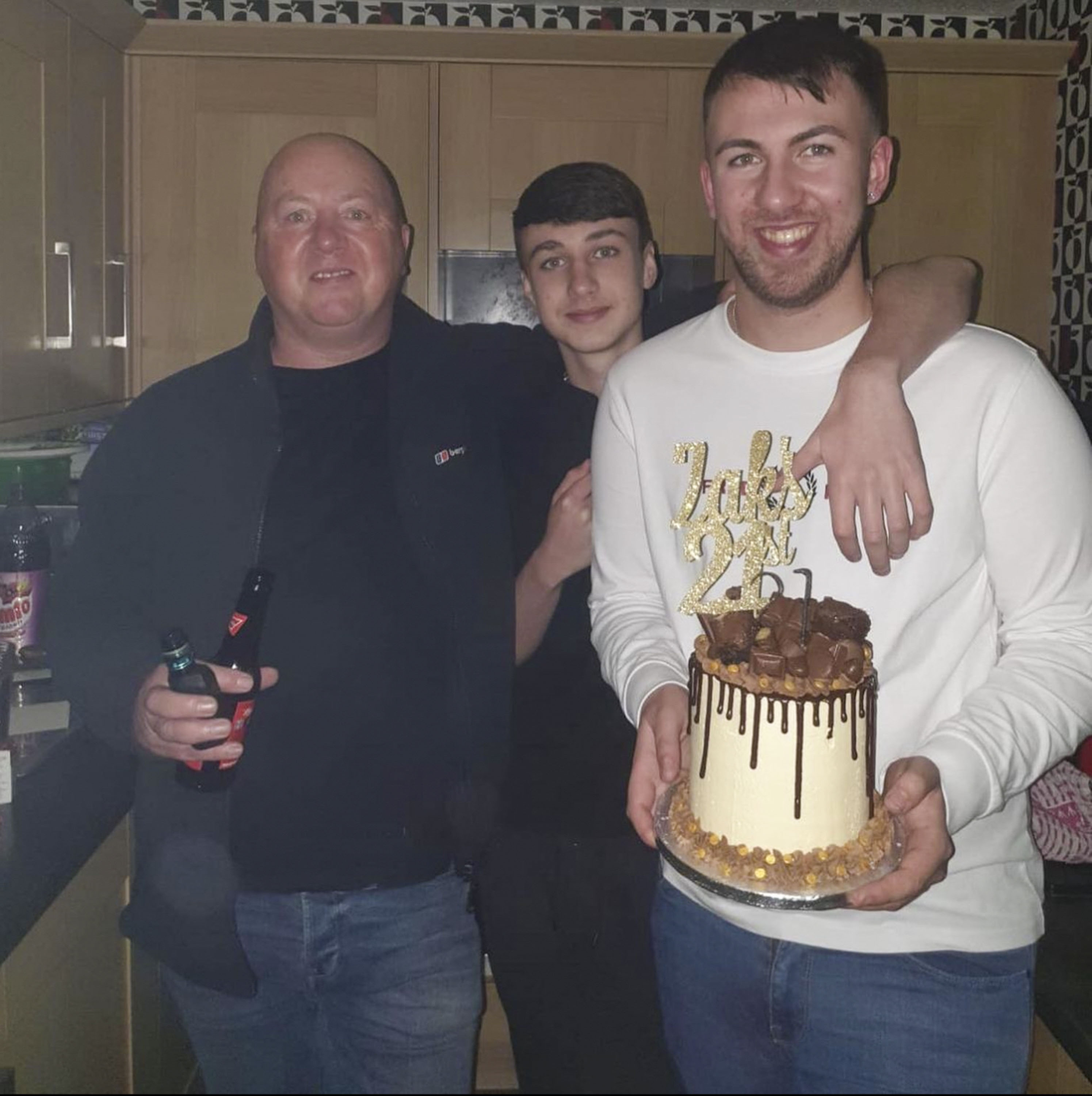 Jay, centre, with dad Warren and brother Zak