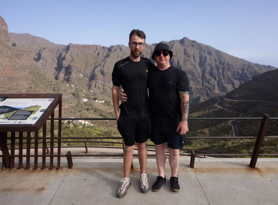 Jay Slater's dad, Warren, 58 (right), and brother, Zak, 24, (left), at the search site in Tenerife