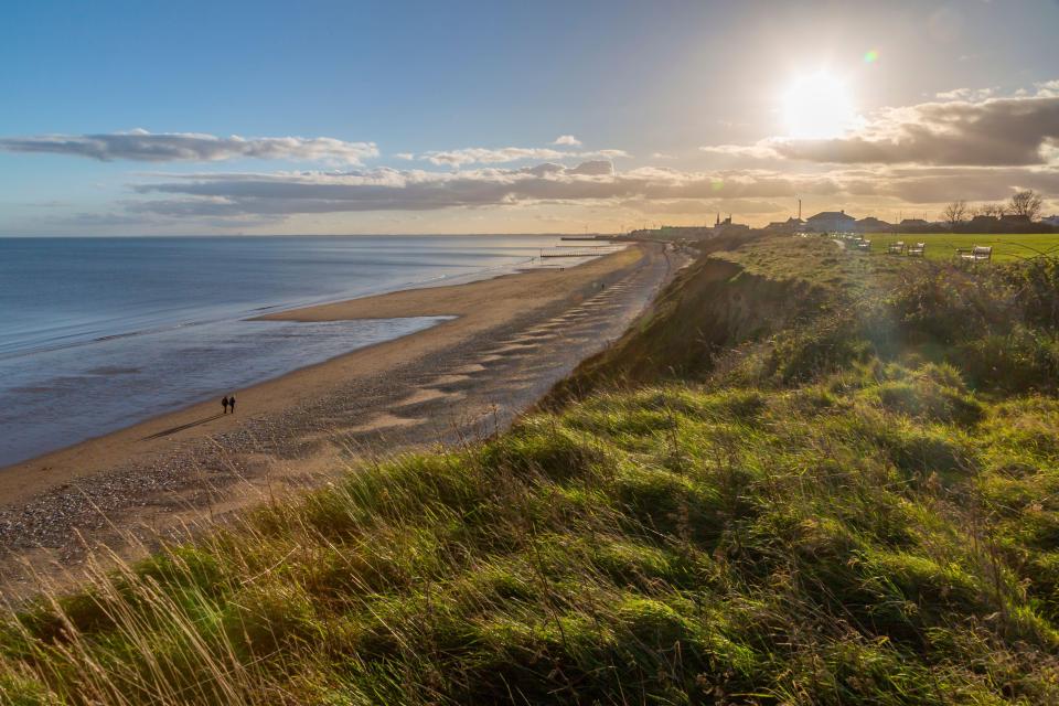 Bridlington North Beach has a sand and shingle shoreline surrounded by wide promenades with shops and cafes