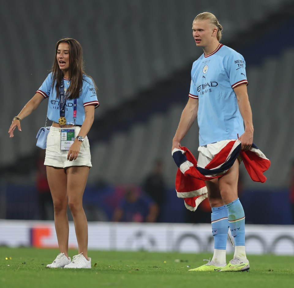 Isabel wearing Haaland's Champions League medal