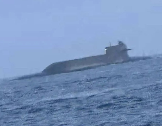 China's menacing military humpback submarine armed with nuclear warheads has been seen surfacing in the Taiwan Strait