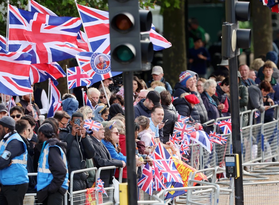 The Mall has been coloured red, white and black by Union flags