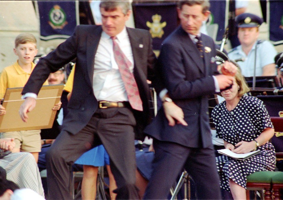 A bodyguard throwing himself in front of Prince Charles in 1994