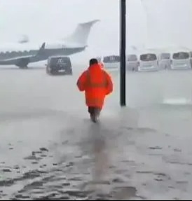 Others were seen wading through knee-high floods