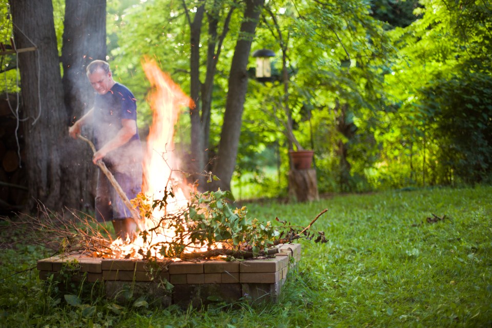 Be sure that the fire is small and controlled without any plastics that could increase smoke emissions and your chances of a fine