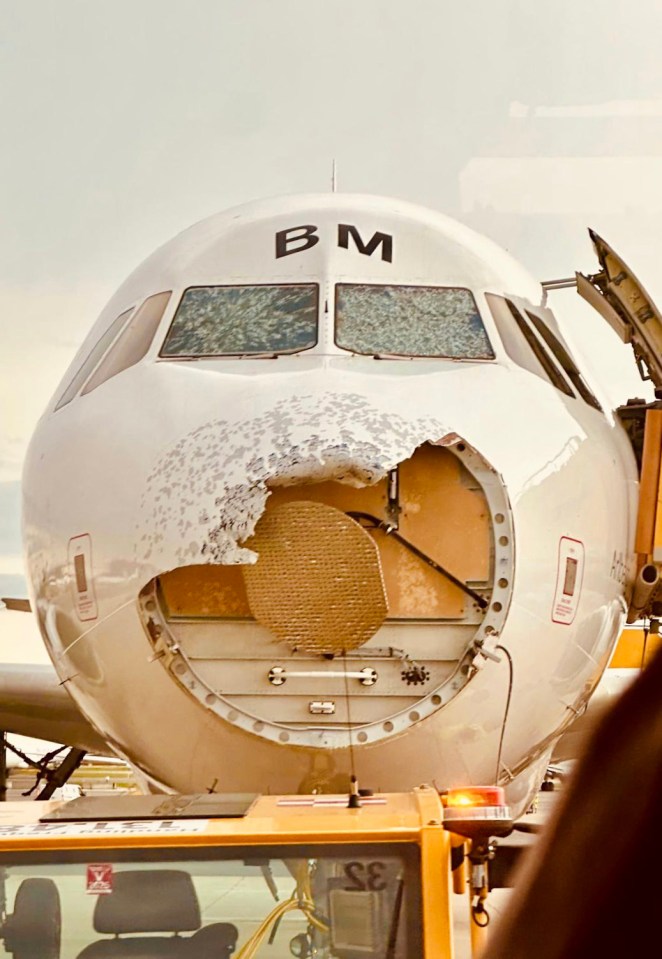 The battered nose of the Austrian Airlines Airbus after it was forced to fly through a hailstorm