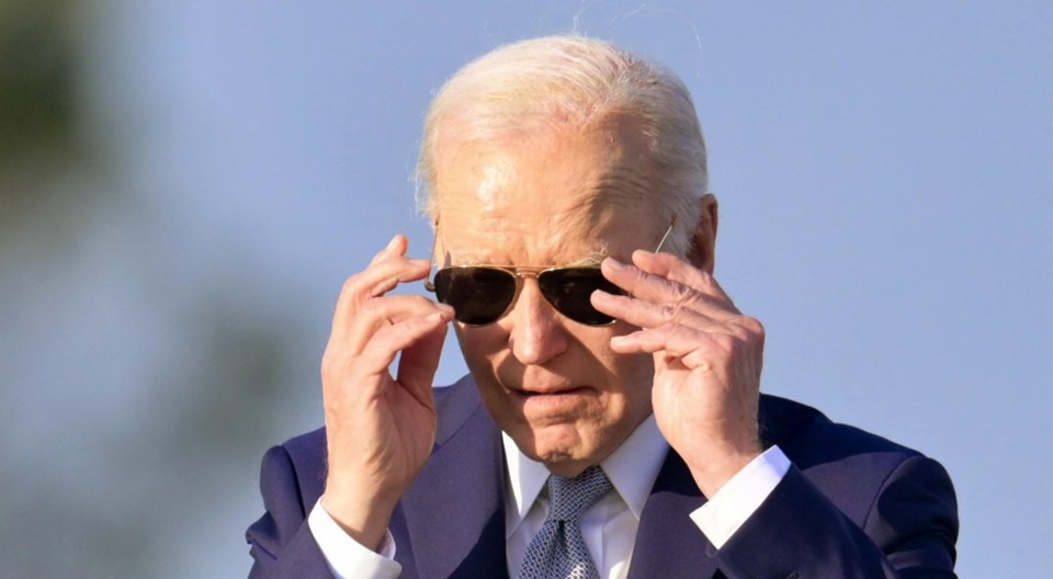 Biden tried to recover from the gaffe by slowly putting his sunglasses on