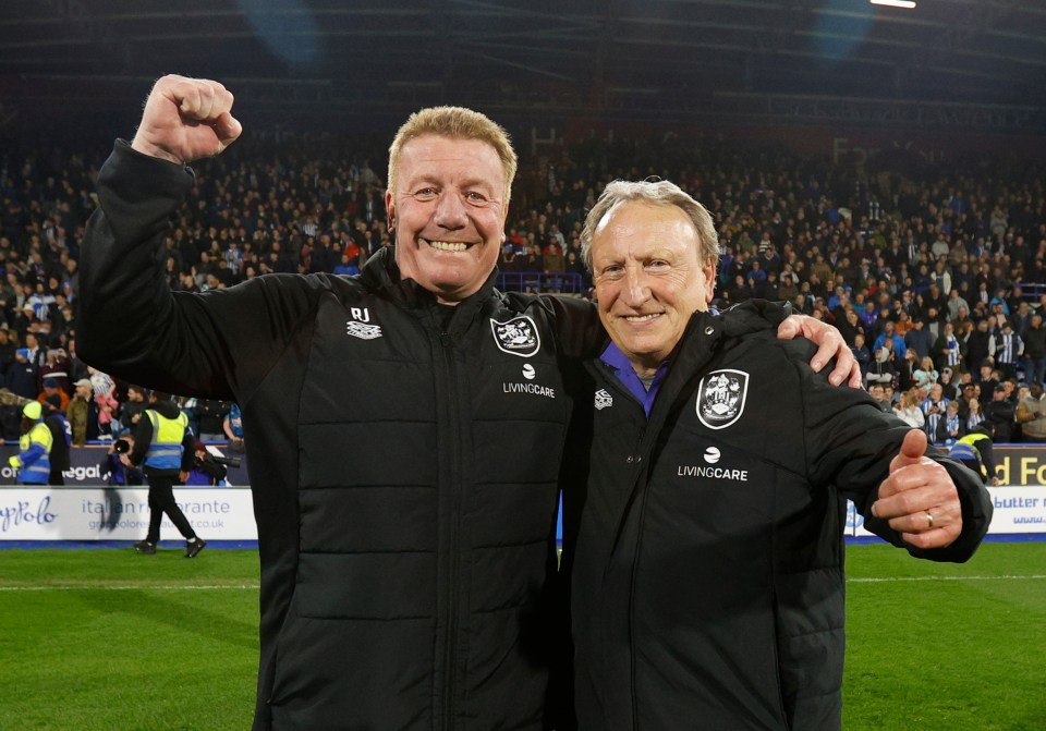 HUDDERSFIELD, ENGLAND - MAY 04: Huddersfield Town Head Coach Neil Warnock celebrates with assistant coach Ronnie Jepson after avoiding relegation by winning the Sky Bet Championship game between Huddersfield Town and Sheffield United at the John Smith's Stadium on May 04, 2023 in Huddersfield, England. (Photo by John Early/Getty Images)