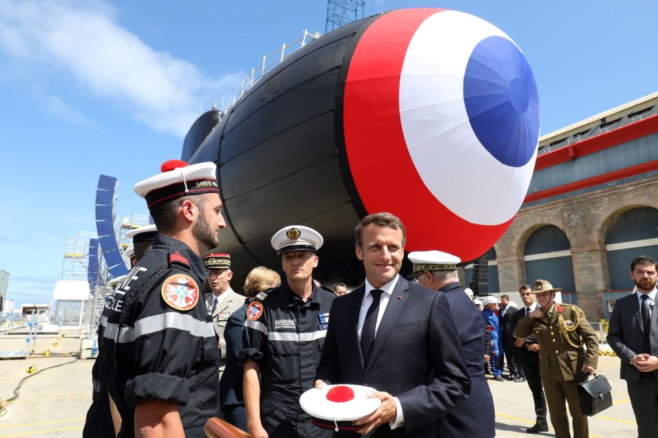 French president Macron with naval personnel in front of French nuclear submarine Suffren