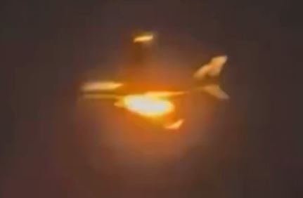 This is the moment flames spurted out from the plane's engine mid-air