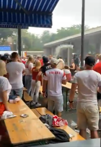 The fan throws the beer in their direction