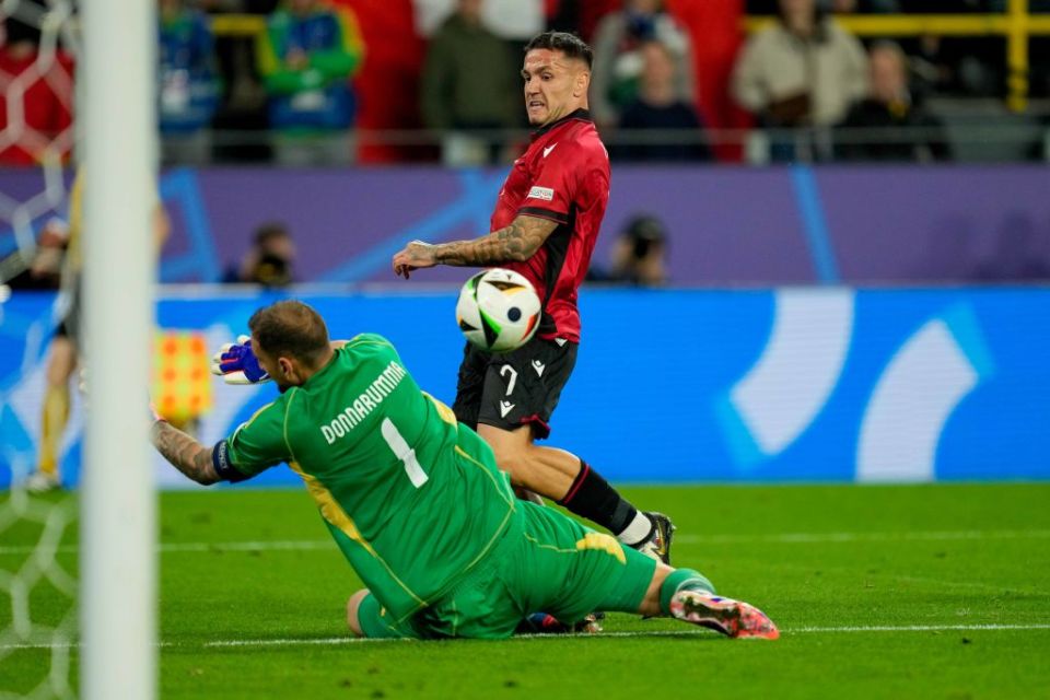 DORTMUND, GERMANY - JUNE 15: Rey Manaj of Albania and goalkeeper Gianluigi Donnarumma of Italy battle for the ball during the UEFA EURO 2024 group stage match between Italy and Albania at Football Stadium Dortmund on June 15, 2024 in Dortmund, Germany. (Photo by Alex Gottschalk/DeFodi Images via Getty Images)