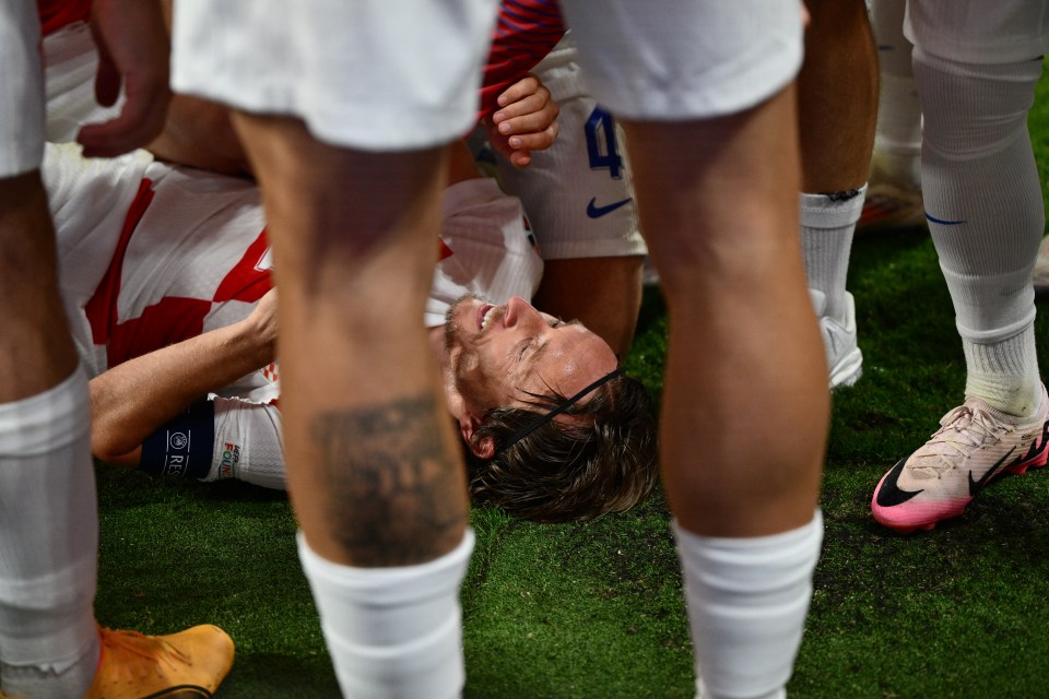 Croatia's midfielder #10 Luka Modric (C) celebrates with teammates after scoring his team's first goal during the UEFA Euro 2024 Group B football match between the Croatia and Italy at the Leipzig Stadium in Leipzig on June 24, 2024. (Photo by Christophe SIMON / AFP) (Photo by CHRISTOPHE SIMON/AFP via Getty Images)