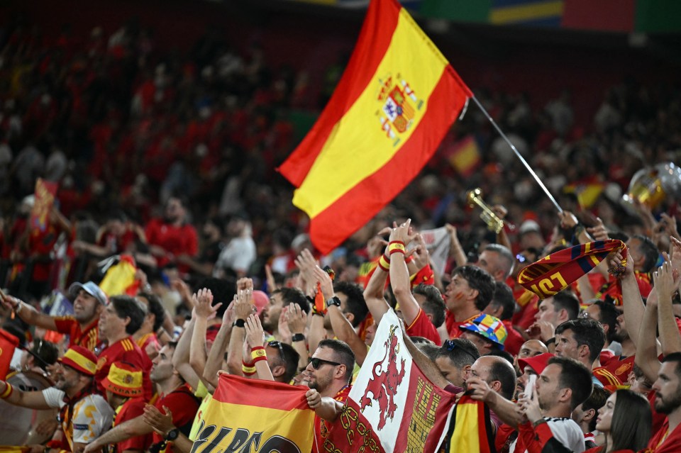 Spain supporters celebrate at the end of the UEFA Euro 2024 Group B football match between Albania and Spain at the Duesseldorf Arena in Duesseldorf on June 24, 2024. (Photo by PATRICIA DE MELO MOREIRA / AFP) (Photo by PATRICIA DE MELO MOREIRA/AFP via Getty Images)