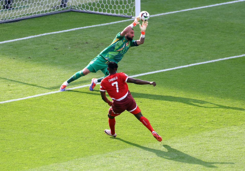 BERLIN, GERMANY - JUNE 29: Gianluigi Donnarumma of Italy saves a shot from Breel Embolo of Switzerland during the UEFA EURO 2024 round of 16 match between Switzerland and Italy at Olympiastadion on June 29, 2024 in Berlin, Germany. (Photo by Lars Baron/Getty Images)