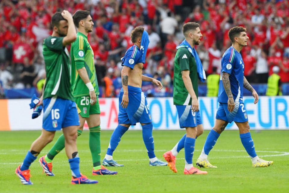 BERLIN, GERMANY - JUNE 29: Italy players show dejection after the team's defeat and elimination from EURO 2024 after the UEFA EURO 2024 round of 16 match between Switzerland and Italy at Olympiastadion on June 29, 2024 in Berlin, Germany. (Photo by Claudio Villa/Getty Images for FIGC)