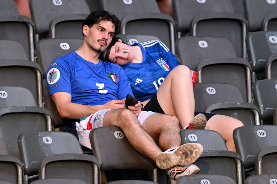 BERLIN, GERMANY - JUNE 29: Fans of Italy show dejection in the stands after the team's defeat and elimination from EURO 2024 in the UEFA EURO 2024 round of 16 match between Switzerland and Italy at Olympiastadion on June 29, 2024 in Berlin, Germany. (Photo by Stu Forster/Getty Images)