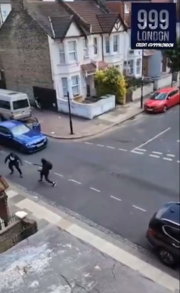 HORROR DUEL Terrifying moment thugs armed with Rambo knives slash and hack at each other in city street fight, pictured: two men fighting with machetes in N15, London, //x.com/999London/status/1805260255951012166, credit: Twitter/@999London