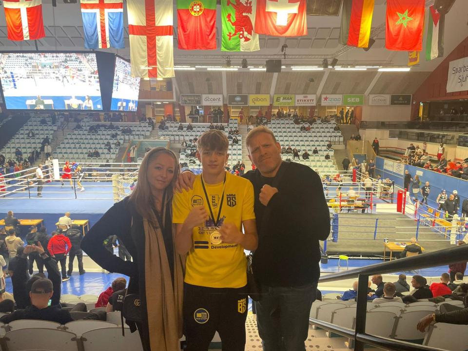 Leo poses with proud parents, mum Jodie and dad Jamie Wood