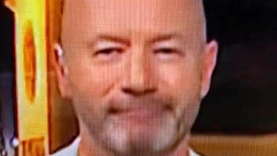 Fans spotted Alan Shearer looking into the camera with a sly grin on his face immediately after Scotland's exit