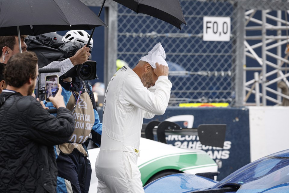 He was seen in a white race suit before getting behind the wheel