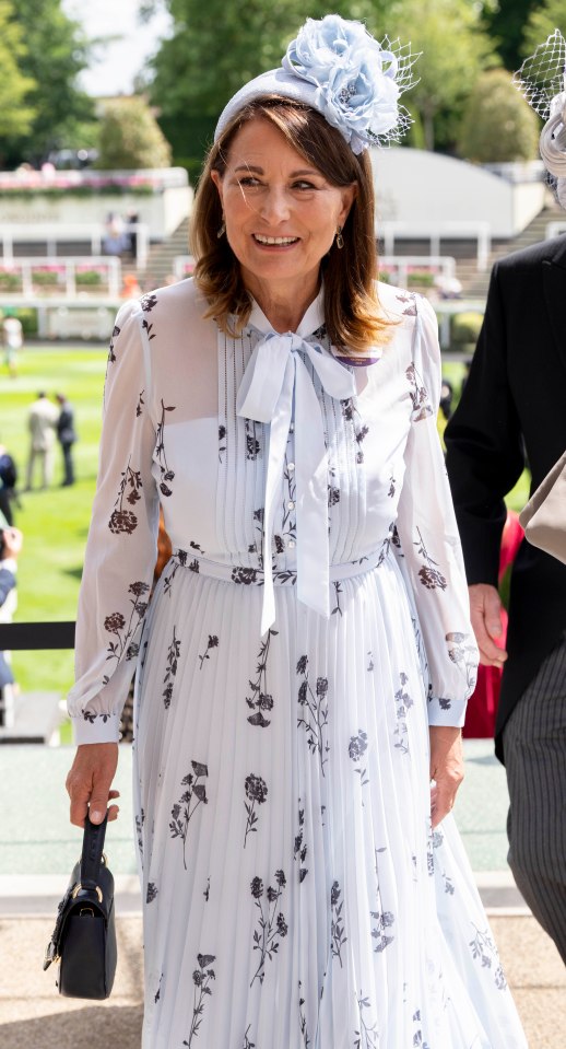 Carol Middleton, 69, stunned in a baby blue floral print dress