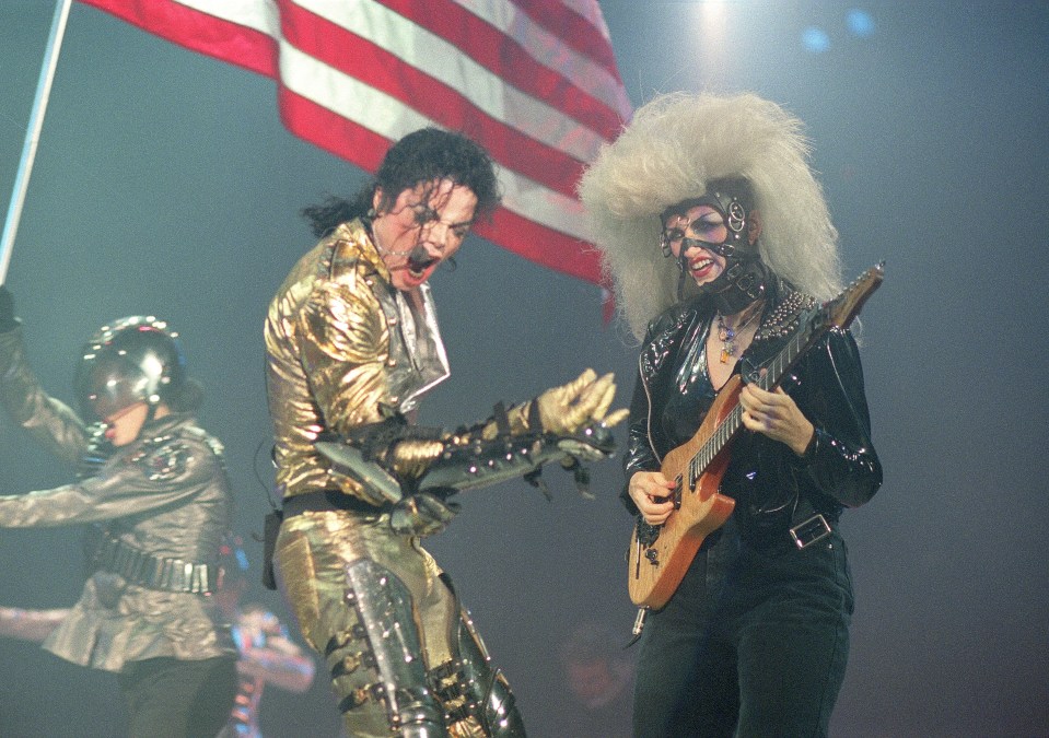 Michael Jackson and Jennifer Batten perform on stage on Jackson’s HIStory tour in 1996