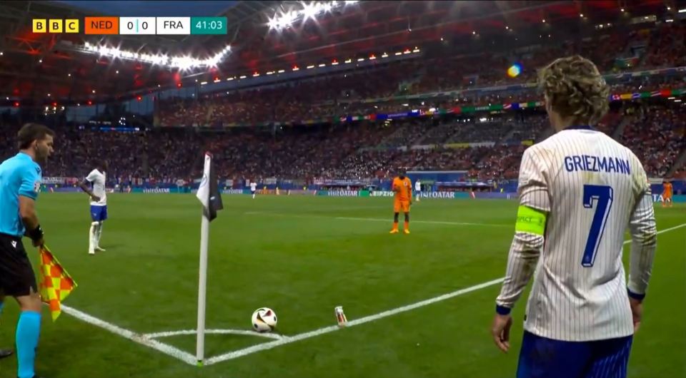 A beer was thrown at Antoine Griezmann while he was taking a corner