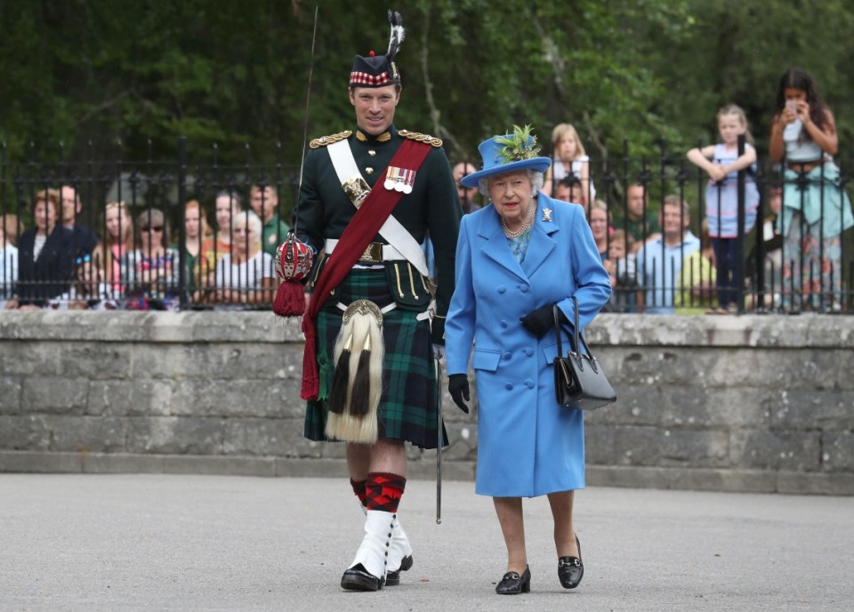 The late Queen Elizabeth II, with Officer Commanding Major Johnny Thompson, inspects Balaclava Company, 5 Battalion The Royal Regiment of Scotland at the gates at Balmoral