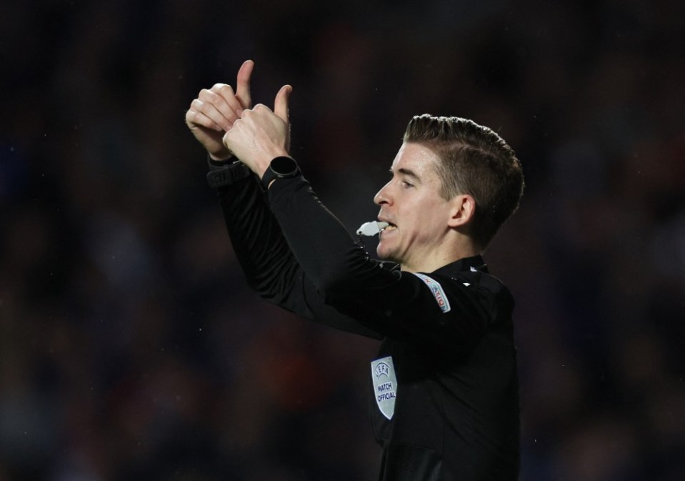 Soccer Football - Europa League - Quarter Final - Second Leg - Rangers v Sporting Braga - Ibrox, Glasgow, Scotland, Britain - April 14, 2022 Referee Francois Letexier gestures REUTERS/Russell Cheyne