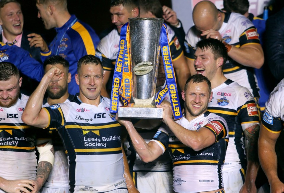 Burrow and Danny McGuire celebrate with the Super League Grand Final trophy in 2018