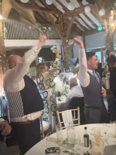 Maria, 37, took to Instagram to share a quick video of the moment the wedding guest twirled their napkins