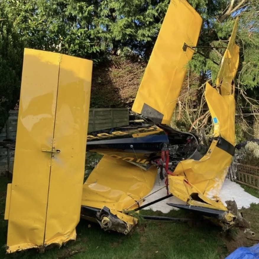 A hero pilot has been praised for dodging houses when his engine failed - and crashing into a couple's back garden while they were watching daytime TV. The quick-thinking of the pilot was highlighted in the official air accident report after he used their garden trees to slow the plane's fall into into the garden of pensioners Jeanette and Geoff Charley. And his crash-landing was so skillful that the couple failed to realise the light aircraft was smashed up in their back garden. It was only when their son rang to ask about the plane crash that they looked outside their kitchen window - and saw the wreckage on their flower beds. WALES NEWS SERVICE