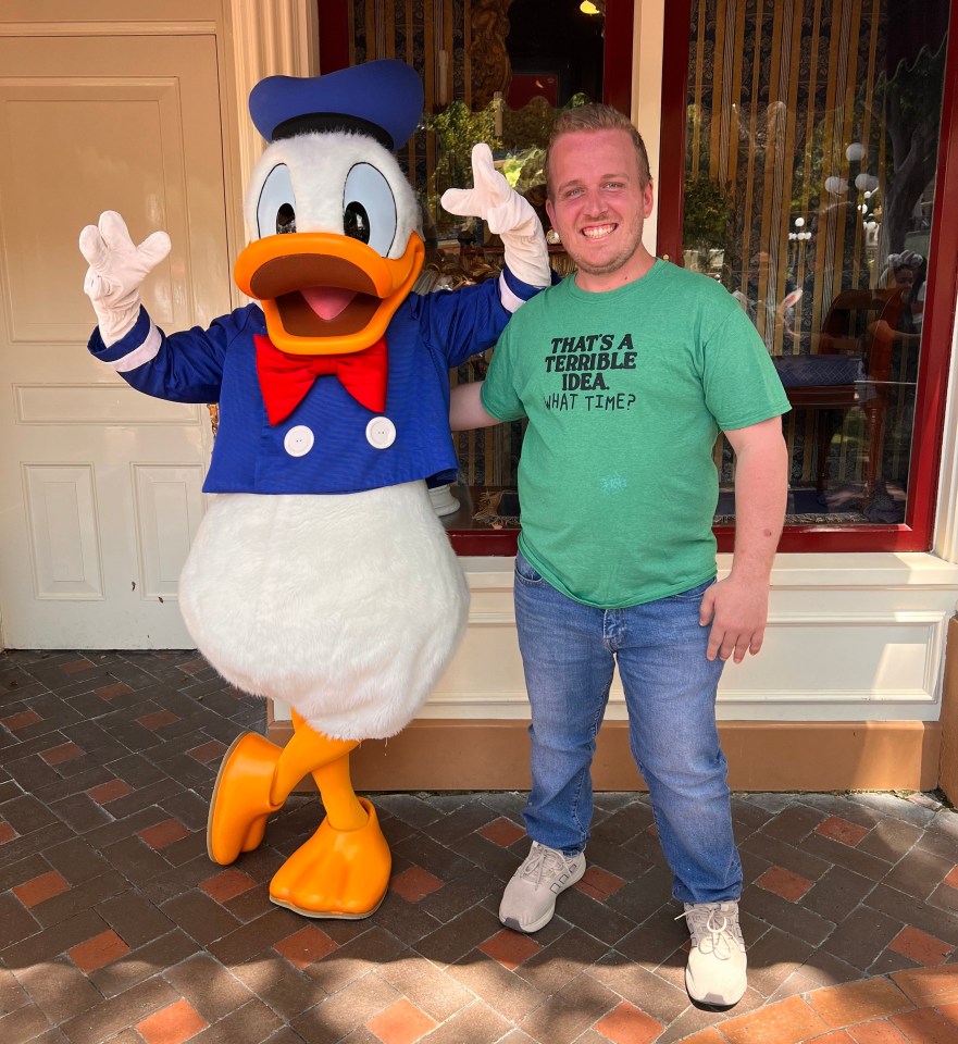 Aric at Disneyland with Donald Duck after getting the implant