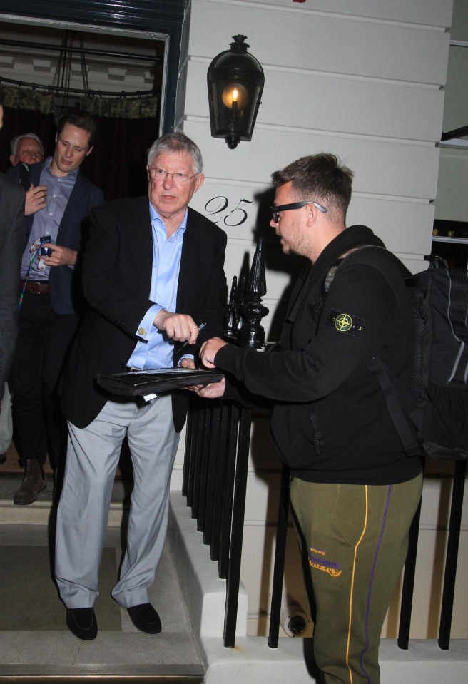 Ferguson signed some autographs as he left the bar