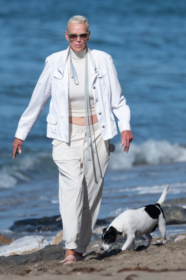 The A-lister took her dog for a beach walk in an all-white outfit