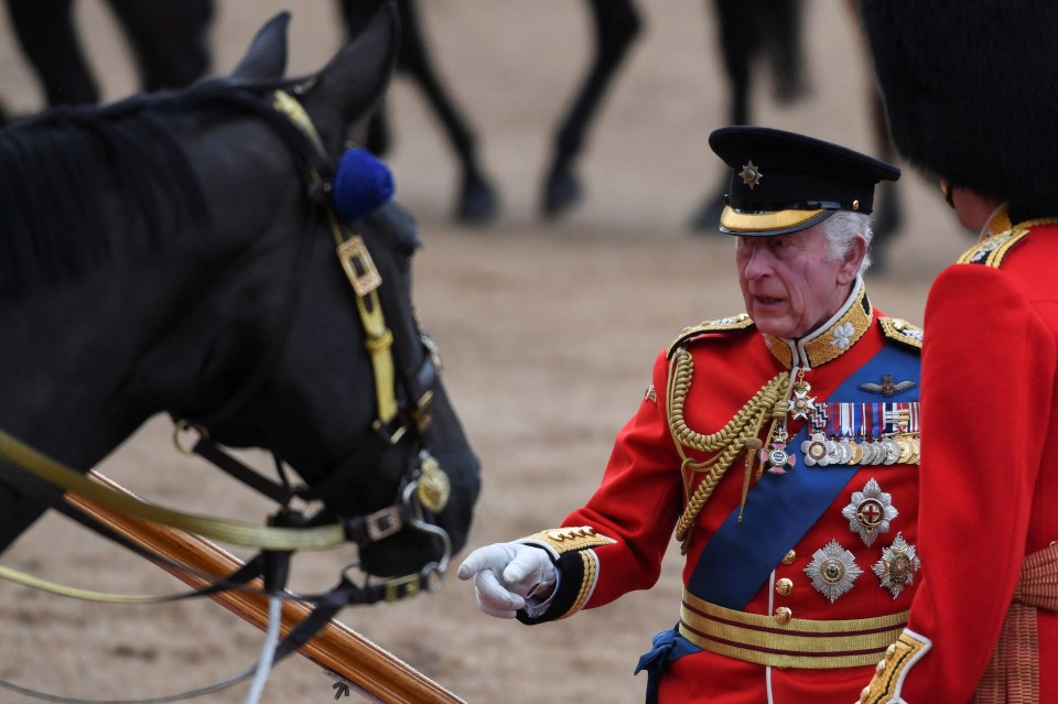 King Charles looked dapper in his red Irish Guards uniform