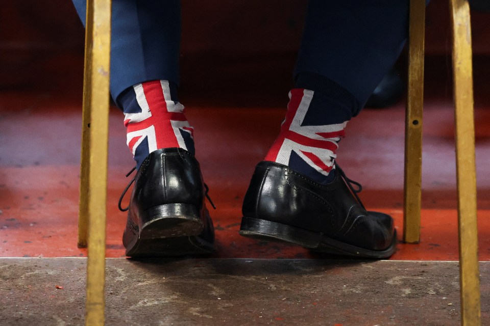 The presentation came hours after Mr Farage — wearing Union Jack socks — admitted for the first time he does have ambitions to enter No10 as PM within five years