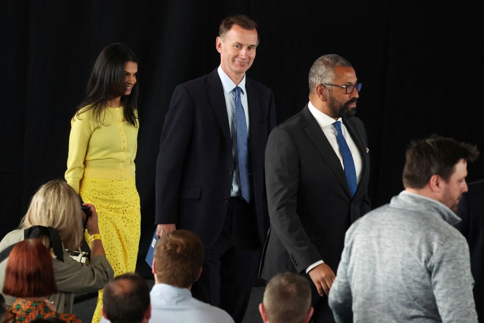 British Home Secretary James Cleverly, Chancellor of the Exchequer Jeremy Hunt and Akshata Murty, wife of Prime Minister Rishi Sunak, enter the launch event for the Conservative Party’s manifesto